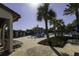 Resort-style community pool with a fun splash area, palm trees, and plenty of seating at 15079 Guava Bay Dr, Winter Garden, FL 34787