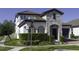 A house with a stone facade, brick driveway, located on the corner of Guava Bay at 15079 Guava Bay Dr, Winter Garden, FL 34787
