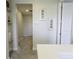 Neutral hallway features shelving, decorative art, and access to multiple rooms at 15079 Guava Bay Dr, Winter Garden, FL 34787