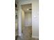 Hallway features shelving, decorative art, and access to multiple rooms at 15079 Guava Bay Dr, Winter Garden, FL 34787