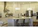 Modern kitchen featuring stainless steel appliances, a center island with seating, and bright pendant lighting at 15079 Guava Bay Dr, Winter Garden, FL 34787
