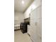 Well-organized laundry room with white cabinets, modern washer/dryer, and ample storage space at 15079 Guava Bay Dr, Winter Garden, FL 34787