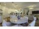 Bright, open-concept living area boasts recessed lighting, hardwood floors, and seamless flow into a modern kitchen at 15079 Guava Bay Dr, Winter Garden, FL 34787