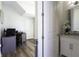 Bright office space with wood floors visible from bathroom, separated by partial white wall at 15079 Guava Bay Dr, Winter Garden, FL 34787