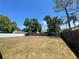 Large backyard enclosed with both vinyl and wooden fencing, providing privacy at 1561 Cypress Woods Cir, St Cloud, FL 34772
