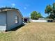 Spacious backyard features a patio area, ideal for outdoor dining and entertaining at 1561 Cypress Woods Cir, St Cloud, FL 34772