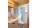 Bright bathroom featuring updated fixtures, a subway-tiled shower, vanity with storage and natural light at 1561 Cypress Woods Cir, St Cloud, FL 34772