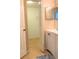 Bathroom features a single sink with white cabinet and an open door to closet at 1561 Cypress Woods Cir, St Cloud, FL 34772