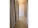 Neutral-toned entryway boasts tile flooring, ample closet space, and a view of the bright white front door at 1561 Cypress Woods Cir, St Cloud, FL 34772