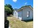 Exterior view of home with a fenced yard providing privacy and security at 1561 Cypress Woods Cir, St Cloud, FL 34772