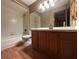 Full bathroom with oak vanity, shower-tub combo, and tile floors at 1835 Harbor Blvd, Kissimmee, FL 34744