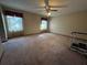 Bedroom featuring carpet, neutral walls, a ceiling fan, and one window providing ample light at 1835 Harbor Blvd, Kissimmee, FL 34744