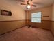 Bedroom featuring neutral walls with a chair rail, one window and carpeted floors at 1835 Harbor Blvd, Kissimmee, FL 34744