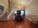 Dining room with hardwood floors, wainscotting, chandelier, and staircase at 1835 Harbor Blvd, Kissimmee, FL 34744