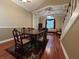 Dining room with hardwood floors, wainscotting, and cathedral ceiling at 1835 Harbor Blvd, Kissimmee, FL 34744