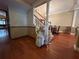 Inviting foyer with hardwood floors, stairlift, and open access to the dining room at 1835 Harbor Blvd, Kissimmee, FL 34744