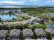 Aerial view of the neighborhood highlighting townhomes and water views at 1933 Estancia Cir, Kissimmee, FL 34741