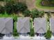 Overhead view of the roofs and driveways of a row of townhomes at 1933 Estancia Cir, Kissimmee, FL 34741