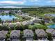 The aerial view shows a beautiful community with ponds, lush greenery, and well-maintained homes at 1933 Estancia Cir, Kissimmee, FL 34741