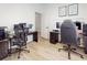 Spacious bedroom with multiple desks, chairs, and great natural light at 1933 Estancia Cir, Kissimmee, FL 34741