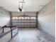Spacious two-car garage with a durable cement floor at 1933 Estancia Cir, Kissimmee, FL 34741