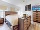 This bedroom features wood accents, neutral tones, and ample storage space for a comfortable and stylish retreat at 1933 Estancia Cir, Kissimmee, FL 34741