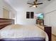 This bedroom boasts modern decor, a stylish ceiling fan, and a large walk-in closet for maximized storage at 1933 Estancia Cir, Kissimmee, FL 34741