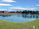 Scenic pond view with a fountain and manicured green surroundings at 1933 Estancia Cir, Kissimmee, FL 34741