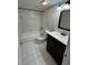 A full bathroom with white tiled walls and tub-shower combination at 200 Maitland Ave # 80, Altamonte Springs, FL 32701