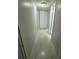 A long hallway showing closet storage with updated flooring and neutral paint at 200 Maitland Ave # 80, Altamonte Springs, FL 32701