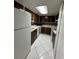 A kitchen with updated floors and neutral colored counters and backsplash at 200 Maitland Ave # 80, Altamonte Springs, FL 32701