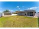 Lovely backyard showcasing lush grass, a convenient storage shed, and a screened patio at 2040 Patriot Way, St Cloud, FL 34769