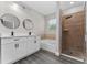 Modern bathroom featuring a glass shower, tub and double vanity sinks at 2040 Patriot Way, St Cloud, FL 34769