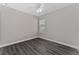 Neutral bedroom featuring a window and modern ceiling fan at 2040 Patriot Way, St Cloud, FL 34769