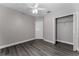 Bedroom with closet and ceiling fan; ample space and natural light at 2040 Patriot Way, St Cloud, FL 34769
