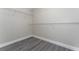 Bright closet featuring wire shelving, gray wood flooring, and a fresh coat of paint at 2040 Patriot Way, St Cloud, FL 34769