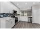 Bright and modern kitchen featuring white cabinets, stainless steel appliances, and stylish backsplash at 2040 Patriot Way, St Cloud, FL 34769