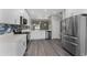 Modern kitchen with stainless steel appliances, white cabinetry and lots of counter space at 2040 Patriot Way, St Cloud, FL 34769