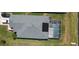 Aerial view of the home's roof, screened-in pool and surrounding landscaping at 2206 Hunters Greene Dr, Lakeland, FL 33810