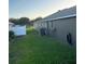 Well maintained lawn with an AC unit alongside the house at 2206 Hunters Greene Dr, Lakeland, FL 33810