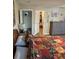 Bedroom featuring decorative comforter, wood floors, and access to an ensuite closet at 2206 Hunters Greene Dr, Lakeland, FL 33810