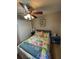 Comfortable bedroom featuring ceiling fan, closet, and colorful bedding at 2206 Hunters Greene Dr, Lakeland, FL 33810