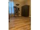 Bedroom with wood floors, a large security safe, and a multi-tiered cat tree at 2206 Hunters Greene Dr, Lakeland, FL 33810