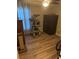 Bedroom with wood floors, a large security safe, and a multi-tiered cat tree at 2206 Hunters Greene Dr, Lakeland, FL 33810