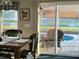 Charming dining area featuring a rustic table and chairs with pool views at 2206 Hunters Greene Dr, Lakeland, FL 33810