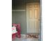 Charming front entrance featuring a cozy bench with a decorative pillow and a welcoming 'Hello' doormat at 2206 Hunters Greene Dr, Lakeland, FL 33810