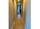 Hallway with tile flooring and views of bedroom and other rooms in the home at 2206 Hunters Greene Dr, Lakeland, FL 33810