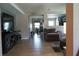 Open-concept living space features tile flooring and views into dining room and living room at 2206 Hunters Greene Dr, Lakeland, FL 33810