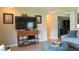 Cozy living room featuring a mounted TV, stylish furnishings, and inviting decor, creating a relaxing atmosphere at 2206 Hunters Greene Dr, Lakeland, FL 33810