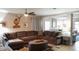 Inviting living room with plush sectional sofa, ceiling fan, and stylish decor at 2206 Hunters Greene Dr, Lakeland, FL 33810